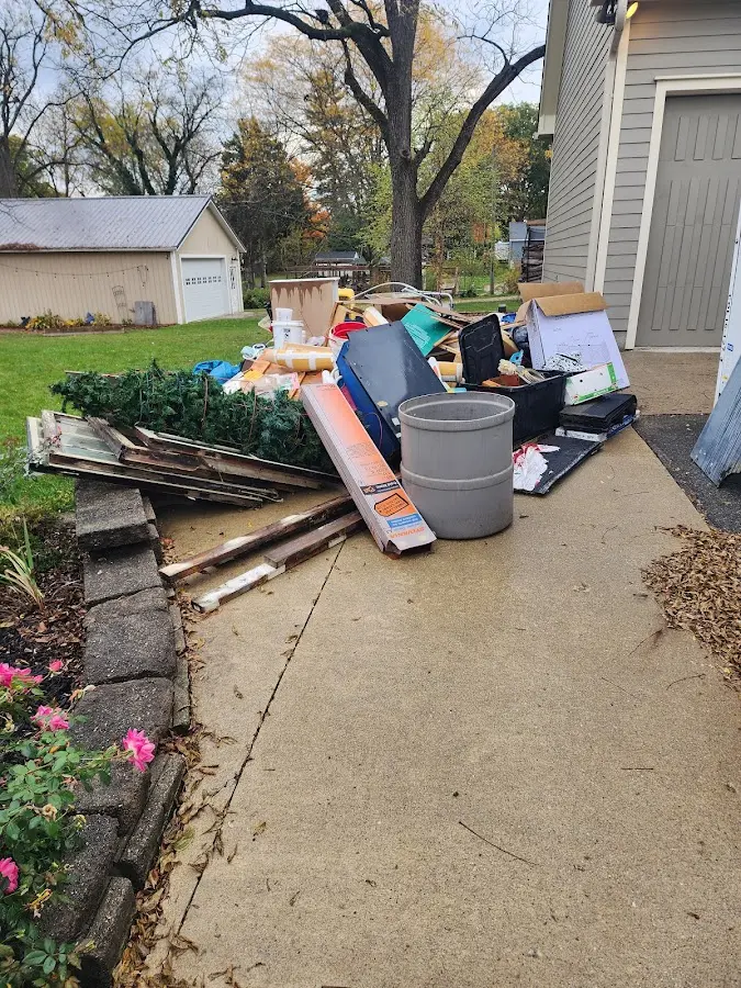 Dumpster being loaded with debris for 3 Yard Dumpster Rental in Boulder Creek